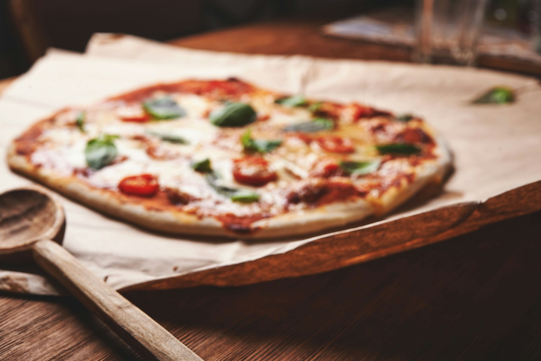 Freshly baked pizza with basil and mozzarella